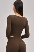 Fitglutes Activewear long sleeve crop top with fitted design, perfect for gym and workout sessions.