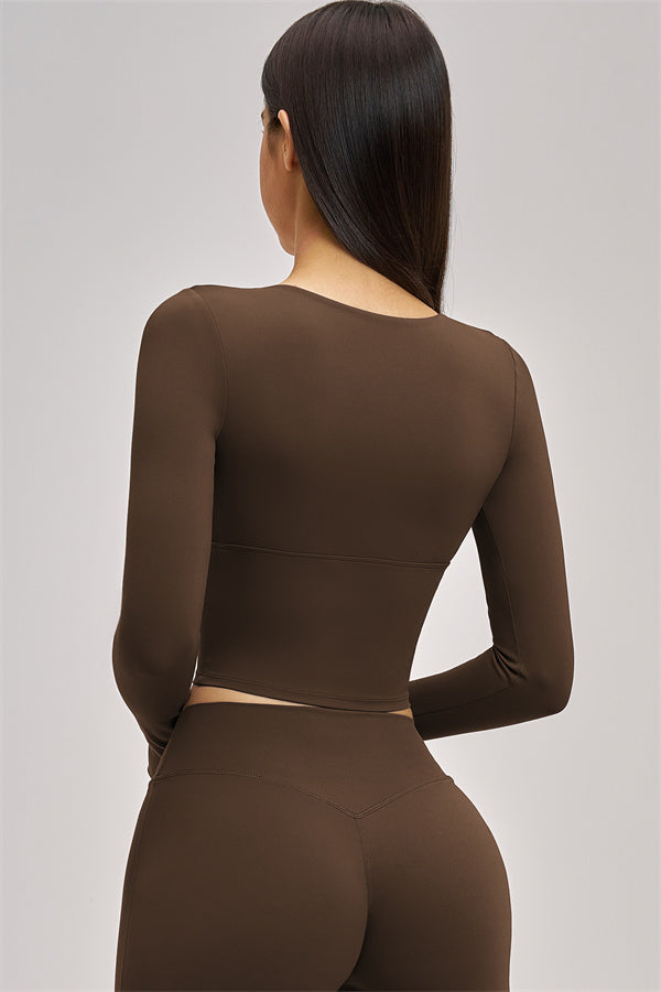 Fitglutes Activewear long sleeve crop top with fitted design, perfect for gym and workout sessions.