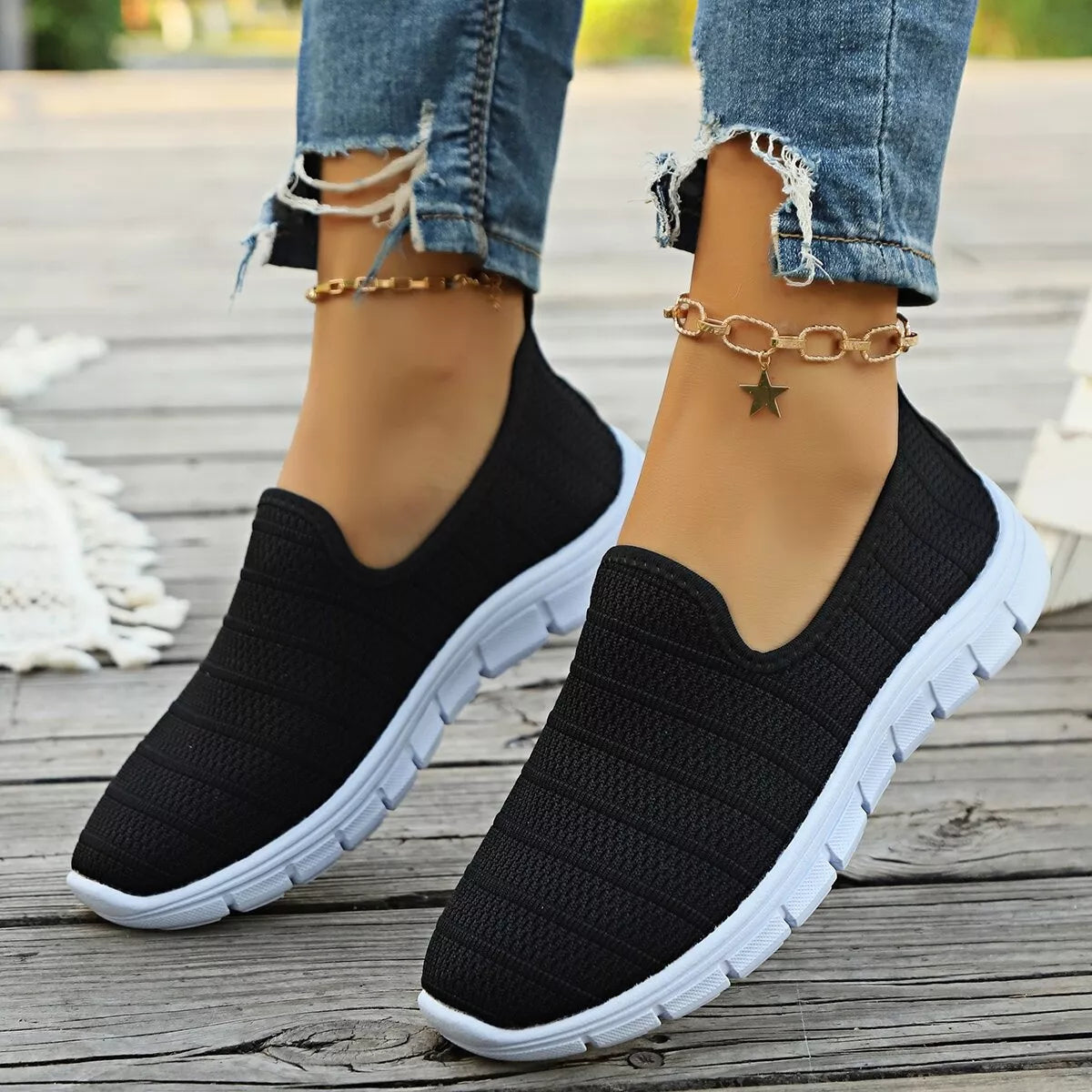 Women's breathable mesh slip-on casual flats by Trendsi, lightweight comfortable walking shoes with mesh uppers and slip-on design.
