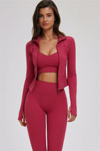 Fitglutes Activewear workout set featuring a cross back sports bra, leggings, and zip jacket for gym and activewear use.