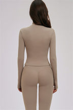 Fitglutes activewear 3-piece set with zip jacket, cross back sports bra, and matching leggings for workout and gym.