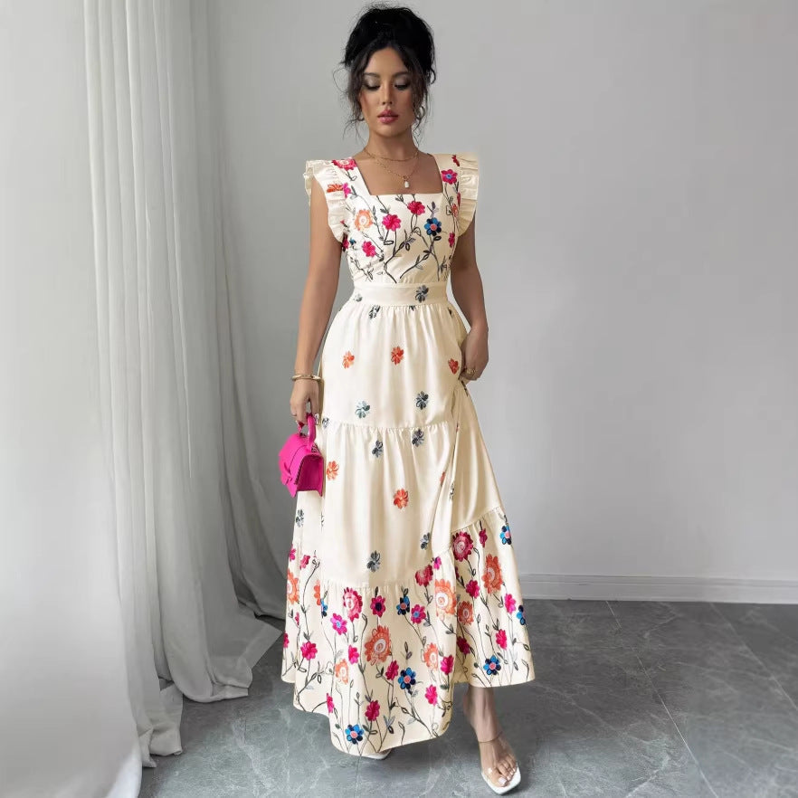 Women's floral print waist-cinching dress with puff sleeves by FitiqueFit, featuring a feminine silhouette and vibrant floral pattern.
