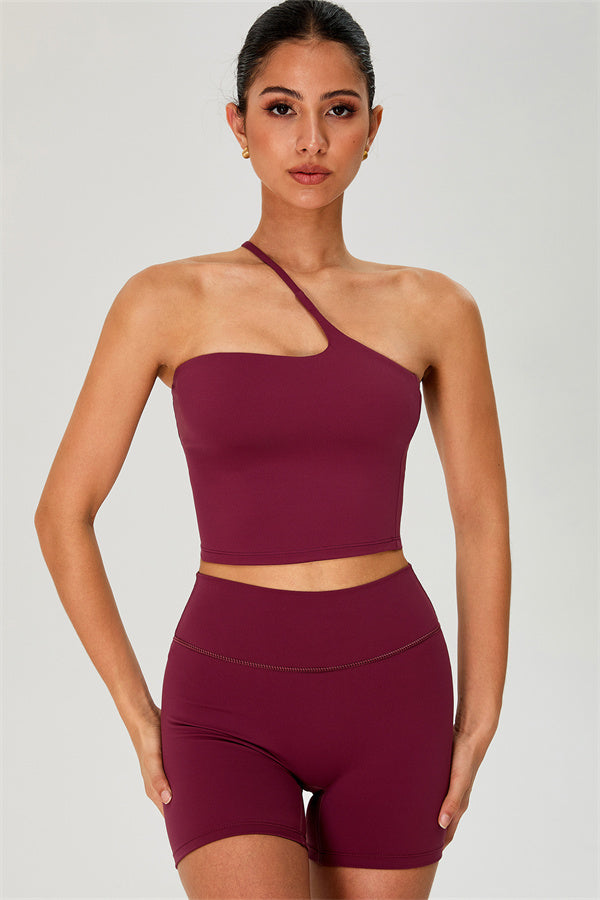 Fitglutes activewear one-shoulder crop top and matching shorts 2-piece gym set, designed for workout and sports activities