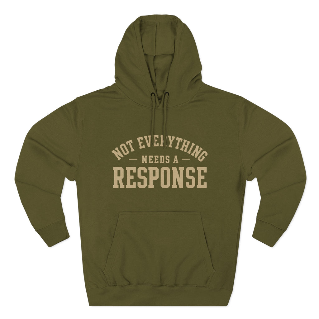 Black "Not Everything Needs a Response" hoodie by Wear Your Worship from the SEEN. Identity Line, showing front view with logo detail.