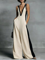 Deep V-neck wide-leg jumpsuit by Trendsi, stylish onesie with flowing fabric and a flattering fit, shown in the image.