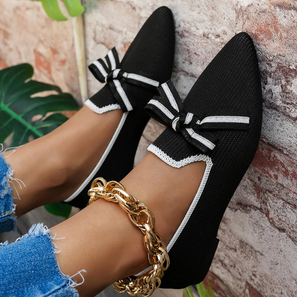 Point toe flats slip-ons from Shopimist with sleek design and comfortable fit, shown in black on a white background.