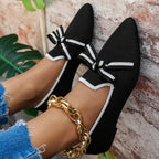 Point toe flats slip-ons from Shopimist with sleek design and comfortable fit, shown in black on a white background.