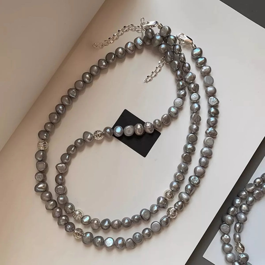 Shopimist pearl choker necklace with white pearls and silver clasp, close-up view of elegant jewelry on a plain background.