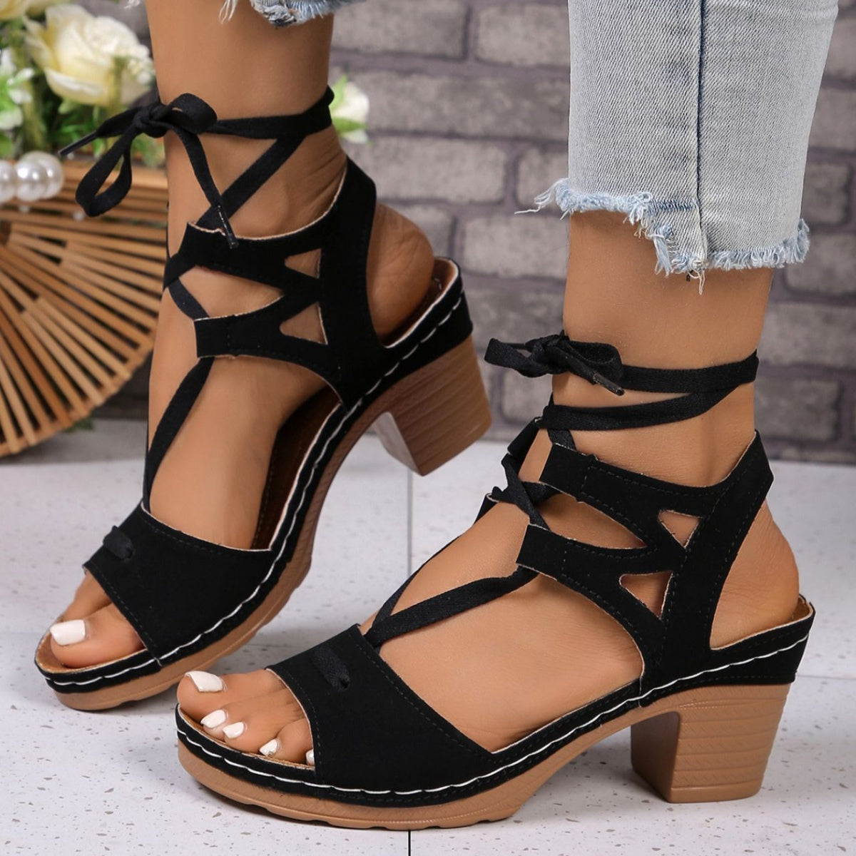 Women's chic lace-up block heel sandals with strappy design and stylish mid-heel height, perfect for fashionable summer outfits.