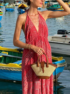 Tiered halter neck maxi dress from Trendsi, featuring flowing fabric and a stylish tiered design perfect for summer wear.