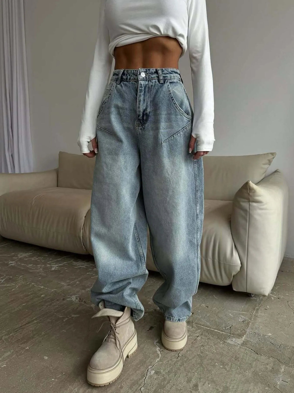 Plush Fashion Hub wide leg denim jeans with a relaxed fit and classic blue wash, displayed on a hanger.