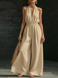 Women’s V-neck halter neck wide-leg jumpsuit by FitiqueFit, casualwear with a stylish V-neck and sleeveless design.