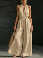 V-neck halter neck jumpsuit for women by Plush Fashion Hub, featuring a stylish design, sleeveless cut, and fitted waist.