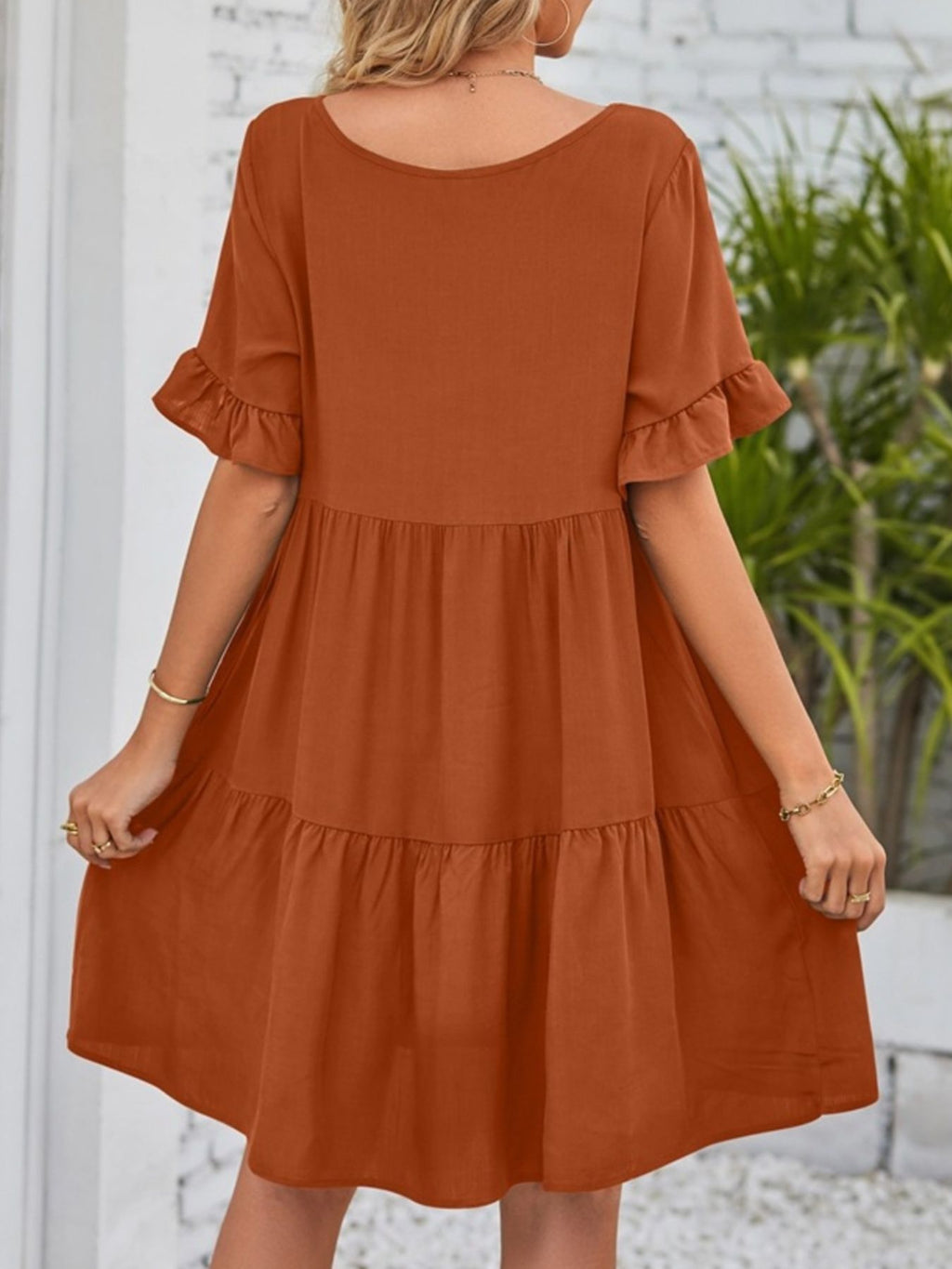 Lightweight rayon ruffled sleeve tiered mini dress with pockets from Trendsi, featuring a feminine, flowy design and stylish details.