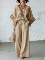Women's casual two-piece set with loose-fit V-neck top and wide-leg pants by Plush Fashion Hub, comfortable and stylish everyday wear.