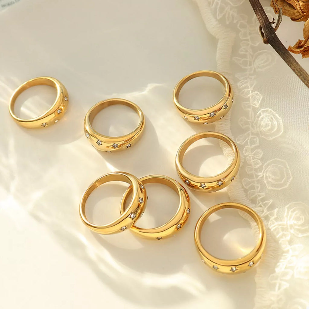18K gold-plated zircon ring with sparkling stones, showcasing elegant jewelry design and intricate detailing.