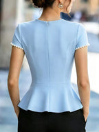 Pearl embellished peplum T-shirt by Shopimist featuring a fitted silhouette and elegant pearl details on soft fabric.