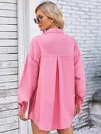 VYSN pocketed snap-down dropped shoulder denim shacket featuring front pockets and relaxed fit, worn styled for casual fashion.