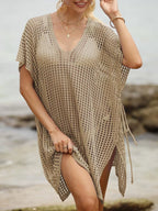 Openwork V-neck slit cover-up by Trendsi, lightweight and stylish, showcasing intricate openwork design and slit details.