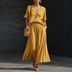 Women's V-neck button-up top and long skirt set by FitiqueFit, casualwear ensemble featuring a stylish V-neck blouse and flowing skirt.