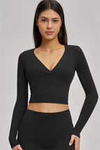 Fitglutes Activewear long sleeve crop top from The Swoon collection, stylish gymwear with a fitted design and breathable fabric.