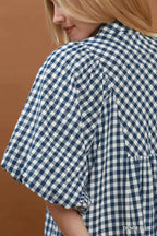 Umgee puff sleeve plaid midi dress featuring a feminine silhouette and stylish design, perfect for casual or semi-formal wear.