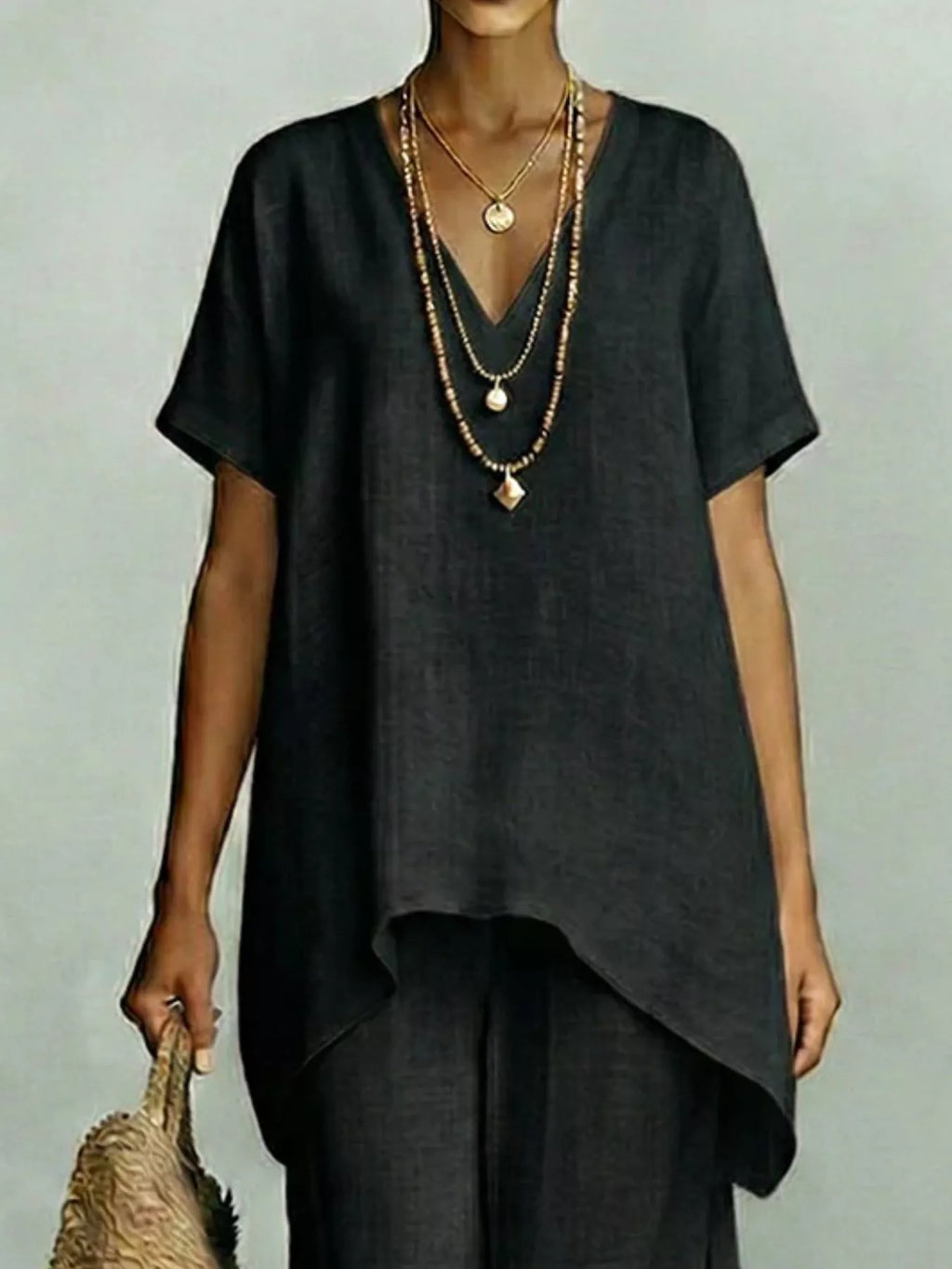 Plus size V-neck top and wide-leg pants set by Shopimist, featuring a comfortable, stylish matching outfit in soft fabric.