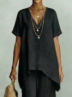 Plus size V-neck top and wide-leg pants set by Shopimist, featuring a comfortable, stylish matching outfit in soft fabric.