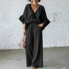 Women's loose-fit V-neck top and wide-leg pants casualwear set by FitiqueFit, featuring comfortable relaxed-fit fabric.