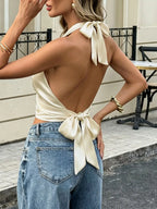 Plush Fashion Hub satin halter neck tank top with sleek design, featuring a fitted halter style and smooth satin fabric.