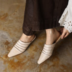 Handmade sheepskin ruched mule slides with square toe and low heel from FitiqueFit, showcasing soft, textured footwear in natural tones.