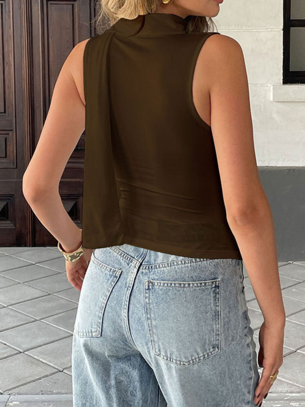 Elegant satin-feel sleeveless cowl neck blouse with ruched details, versatile cami top by Trendsi.