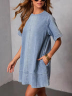 Women's casual denim dress with short sleeves and pockets, trendy dress from Trendsi featuring a relaxed fit and stylish design.