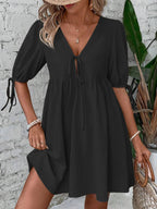 Cotton V-neck tie-front mini dress with puff sleeves, stylish and comfortable, by Trendsi.