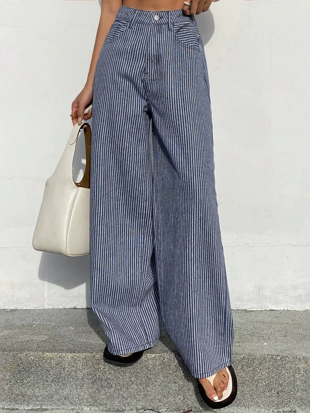 Shopimist striped wide-leg jeans with a high waist and bold vertical blue and white stripes, full-length and relaxed fit.