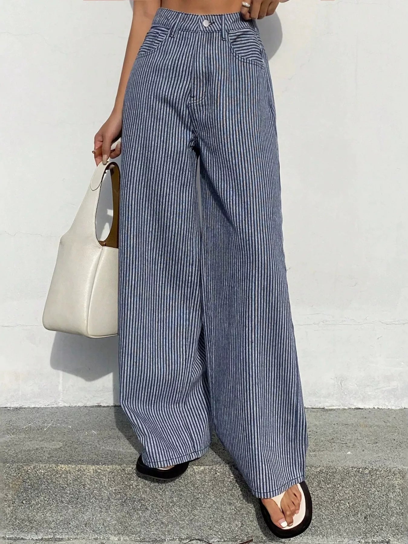 Shopimist striped wide-leg jeans with a high waist and bold vertical blue and white stripes, full-length and relaxed fit.