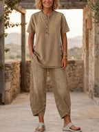 Women's lapel button-up top and pants two-piece set with three-quarter sleeves by Plush Fashion Hub, shown on a model.