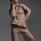 Women’s Fall Winter two-piece casual wear set by FitiqueFit featuring a loose collar sweater and matching pants.