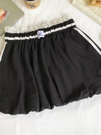 Lace trim elastic waist mini skirt from Trendsi featuring a fitted silhouette and soft, flowy fabric for a stylish look.