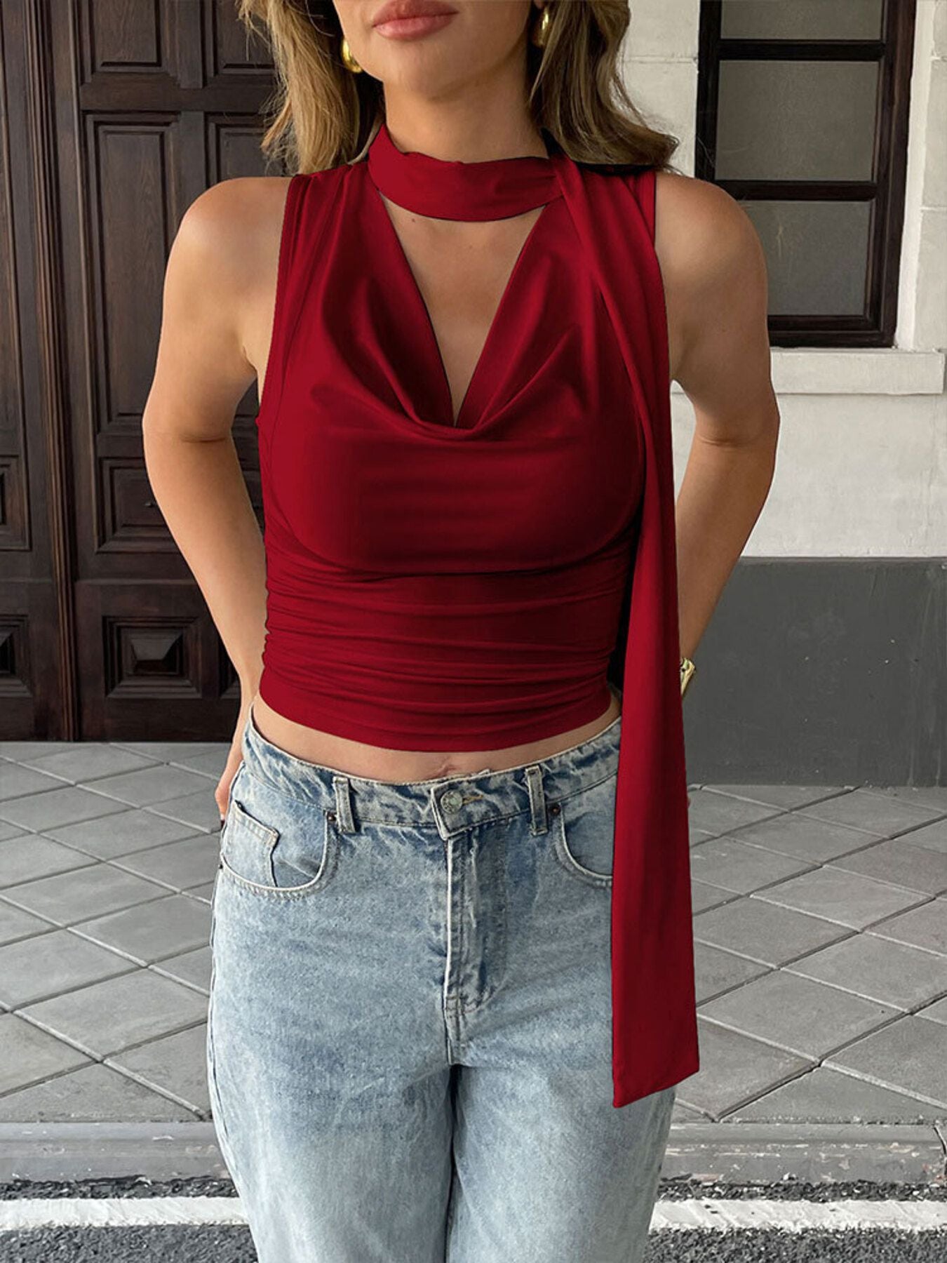 Satin-feel sleeveless cowl neck blouse with ruched detailing, versatile and elegant, perfect for stylish outfits.