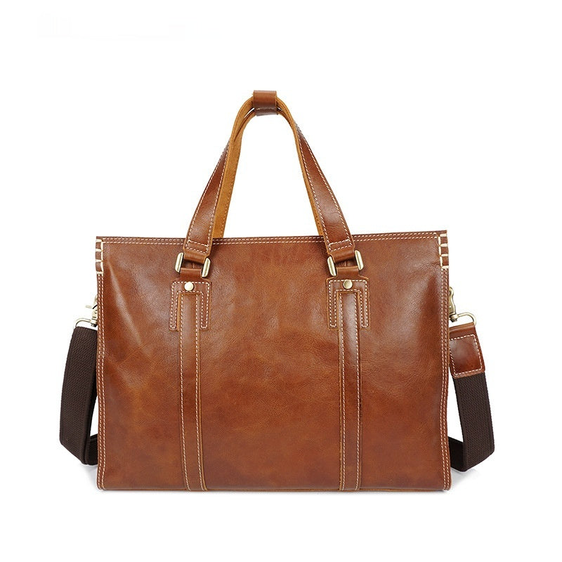 First layer cowhide oily leather shoulder messenger bag with adjustable strap and front pocket, by Plush Fashion Hub.