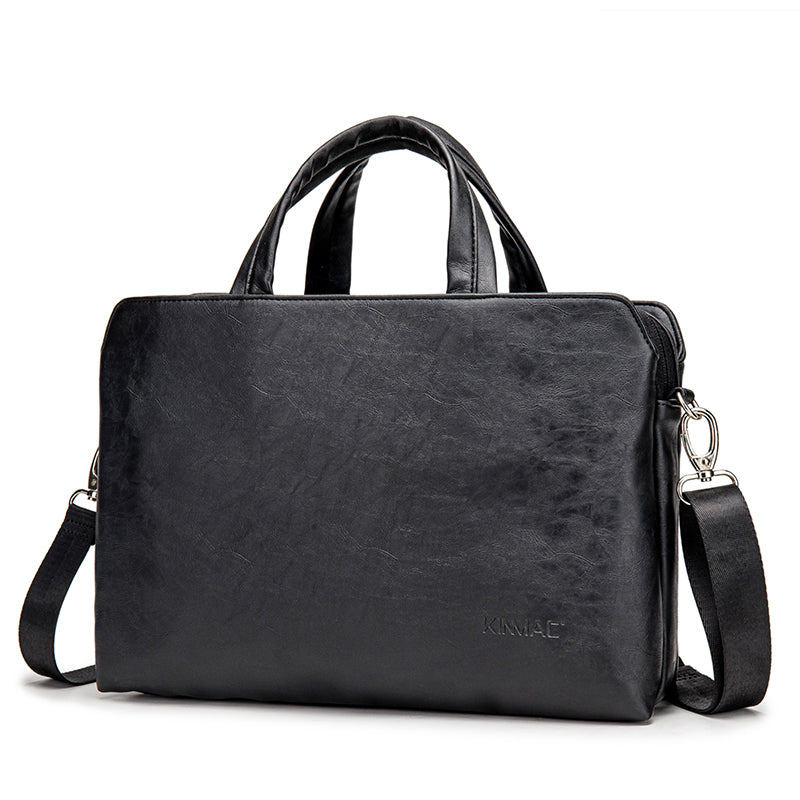 Leather handheld one-shoulder business notebook briefcase by Plush Fashion Hub, featuring a sleek design with sturdy handle and shoulder strap.