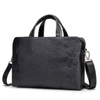 Leather handheld one-shoulder business notebook briefcase by Plush Fashion Hub, featuring a sleek design with sturdy handle and shoulder strap.