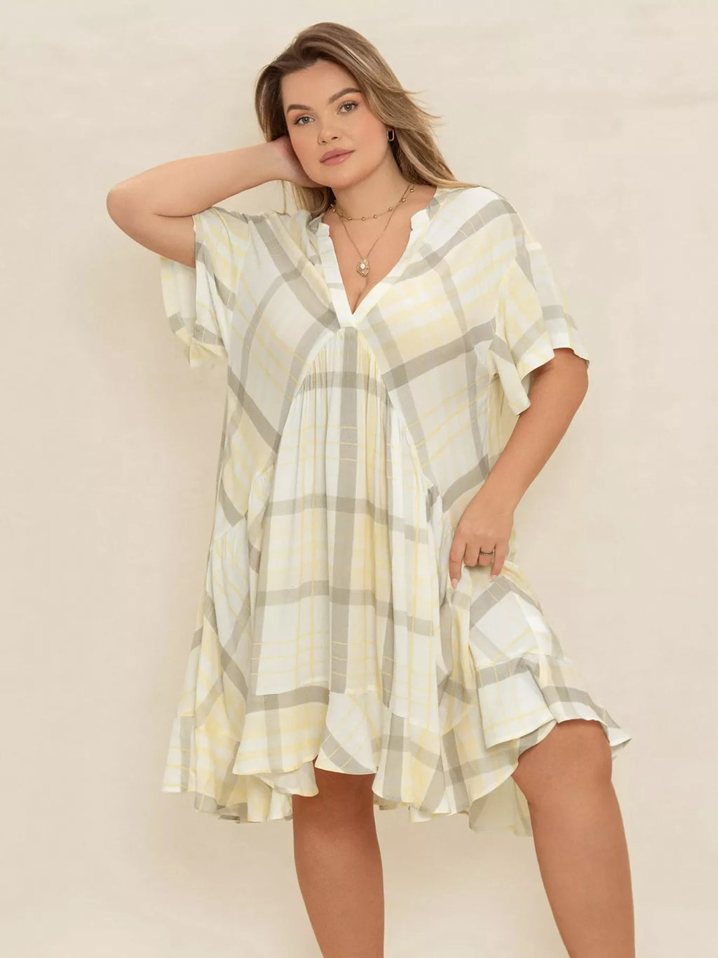 Plus size plaid flutter sleeve dress by Shopimist, featuring a stylish plaid pattern and flowing flutter sleeves.