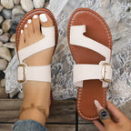 Shopimist toe loop buckle sandals with stylish straps, featuring a secure buckle closure and a comfortable flat sole.