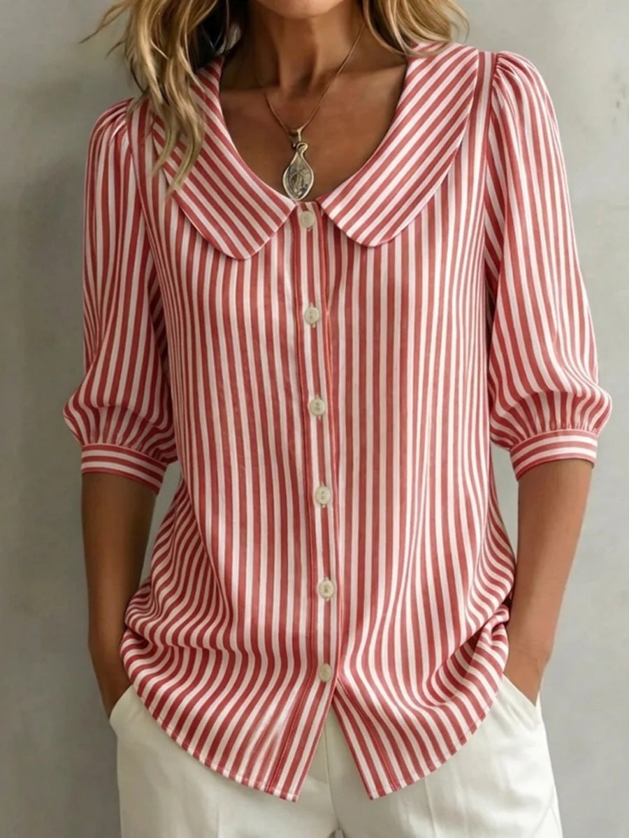 Striped V-neck top with three-quarter sleeves in casual wear style from Plush Fashion Hub, shown on a hanger.