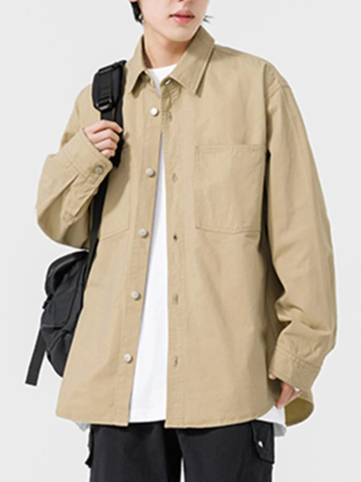 Men's long sleeve button-up shirt by Trendsi, featuring a classic design and collar, shown in a detailed front view.