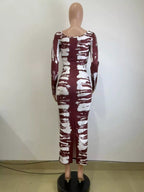 Colorful tie-dye long sleeve maxi dress by Shopimist, flowing fabric with vibrant patterns, perfect for casual or boho style.