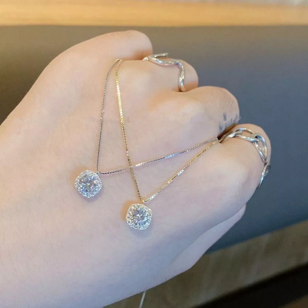 Sterling silver zircon pendant necklace with a delicate chain, showcasing a sparkling zircon stone as the centerpiece.