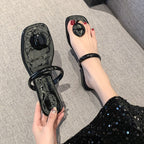 Black patent leather square-toe mules heels by eprolo, showcasing sleek design and stylish square toe in a close-up image.